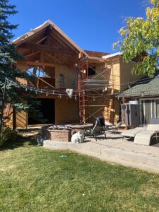 Home addition construction with exterior framing