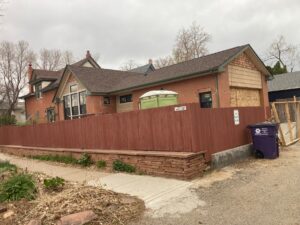 Denver home addition exterior behind a privacy fence