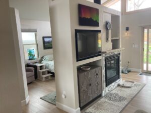 Finished garage conversion living room with fireplace